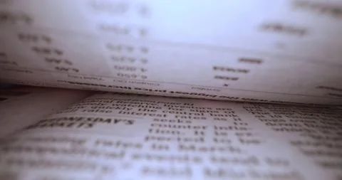 Macro shot through finance articles Stock Footage 179532488