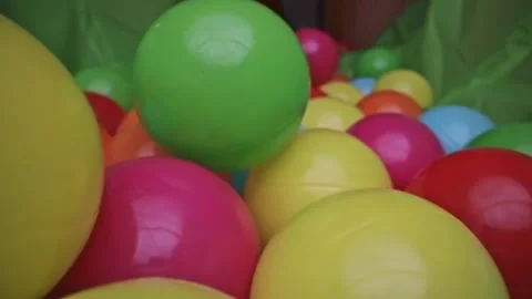 Macro shot through group of colorful toy balls Stock Footage 132212559