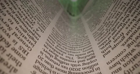 Macro shot through newspaper article Stock Footage 179554098