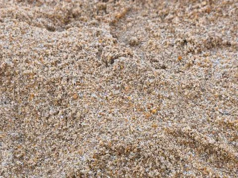 Macro Shot of Tiny Beach Sand Grains Showing Natural Patterns and Fine Texture Stockfoto's