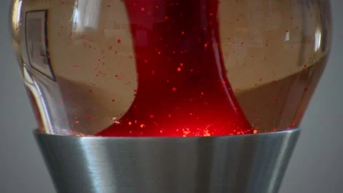 Macro shot of tiny bubbles floating through the bottom part of a stainless Stock Footage 208262934