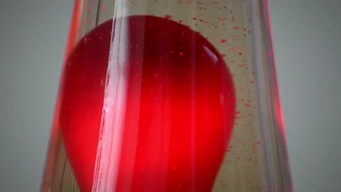 Macro shot of tiny red bubbles inside lava lamp isolated in front of a Stock Footage 208263921