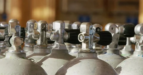 A macro shot of the top part of a group of oxygen tanks. Stock Footage 209941629