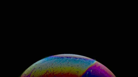 Macro shot of top of soap bubble with an iridescent multicolored surface Stock Footage 146527159