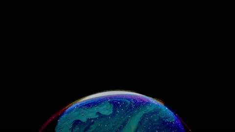 Macro shot of top of soap bubble with mesmerizing blue-pink colored surface Stock Footage 146527984