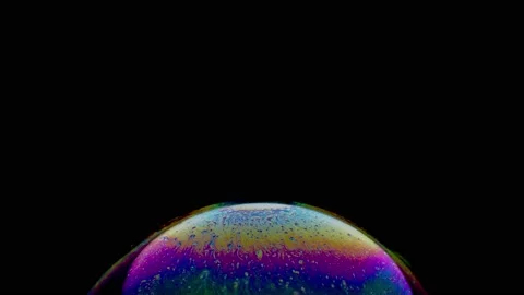 Macro shot of top of soap bubble with magical blue yellow colored surface Stock Footage 146528638