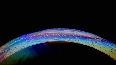 Macro shot of top of soap bubble with beautiful rainbow colored surface Stock Footage 146529611