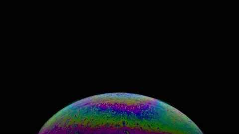 Macro shot of top of soap bubble with beautiful rainbow multicolored surface Stock Footage 146530017