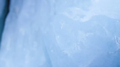 Macro shot of translucent and luminous ice, in the Alps, Switzerland Stock Footage 240148813