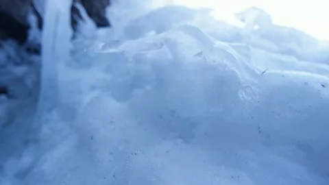 Macro shot of translucent and luminous ice, in the Alps, Switzerland Stock Footage 240156825
