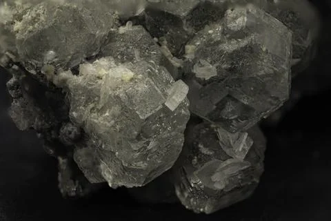 Macro shot of translucent fluorite crystals displaying cubic structure on d.. 写真素材