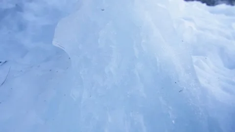 Macro shot of a translucent frozen ice block, in the Alps, Switzerland Stock Footage 240155267