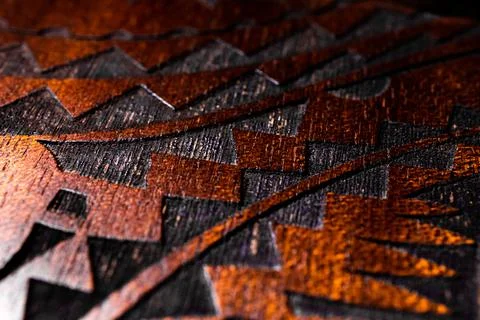 Macro Shot of Triangular Tribal Style Wood Engraving Foto stock
