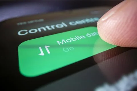 Macro shot of turning on mobile data on a smartphone Foto stock