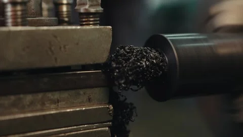 Macro shot of turning a plastic part on a lathe undercut of the internal part of Stock Footage 284544367