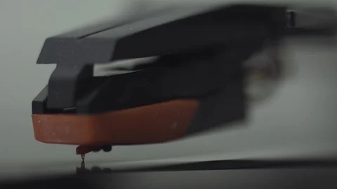 MACRO SHOT OF TURNTABLE NEEDLE ON MOVING VINYL Stock Footage 126236473