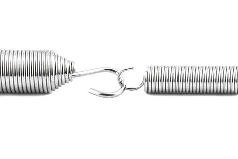 Macro shot of two new linked springs, isolated on a white background. Stock Photos