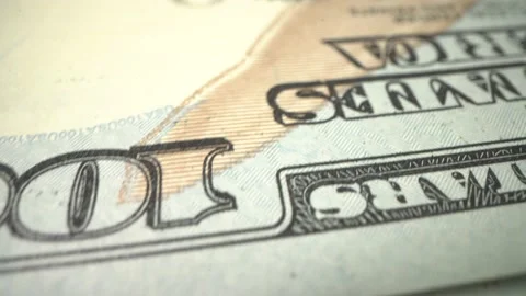 Macro shot of US american dollar bill. Rotate on the table. 100 dollars, Close Stock Footage 134526885
