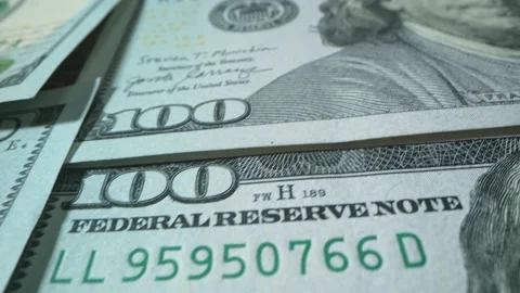 Macro shot of US Dollars. Money Background.Portrait of Benjamin Franklin closeup Video stock 192954409