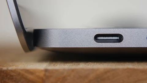 Macro shot of a USB Type-C thunderbolt connectors in laptop. Dolly slider Stock Footage 114056235