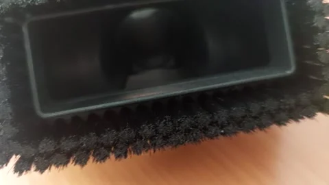 Macro shot of vacuum cleaner nozzle bristles and suction opening Stock Footage 333641422