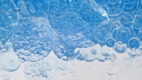 Macro Shot of Various Air Bubbles in Water Rising up on Light White Background Stock Footage 152017039