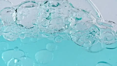 Macro Shot of Various Air Bubbles in Water Rising up on Light White Background 스톡 동영상 215994297