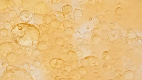 Macro Shot of Various Air Bubbles in Water Rising up on Light White Background Stock Footage 248640237