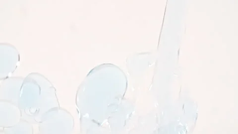 Macro Shot of Various Air Bubbles in Water Rising up on White Background. Liquid Stock Footage 263726540
