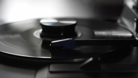 Macro Shot of Vinyl Record Playing with Turntable Tonearm Stock Footage 333757473