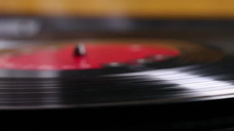 Macro shot of vinyl record start and stop spinning. Stock Footage 46493655