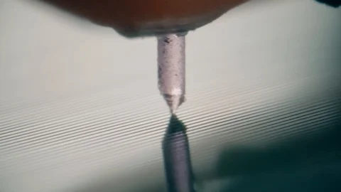 Macro shot of a vynil record player needle moving along the soundtrack Video stock 87701791