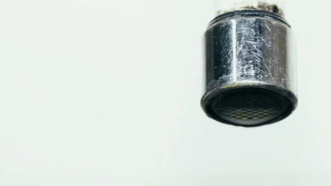 Macro Shot of Water Dripping from Chrome Faucet Spout Aerator Vídeos de archivo 344690556