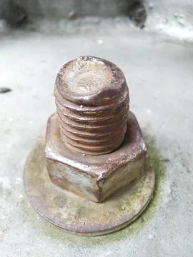 Macro shot of a weathered, rusty bolt, nut, and washer. Stock Photos