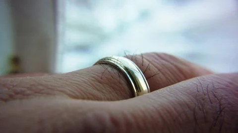 Macro shot of wedding ring on a male hand Stock Footage 83080356