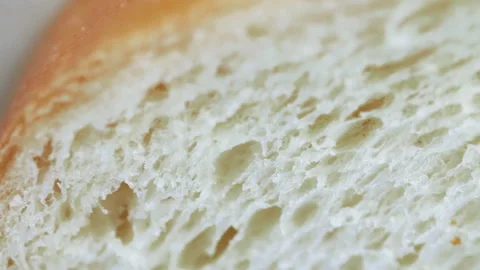 Macro shot of white bread slice texture. Closeup. Selective focus. Slow pan. Stock Footage 107966762
