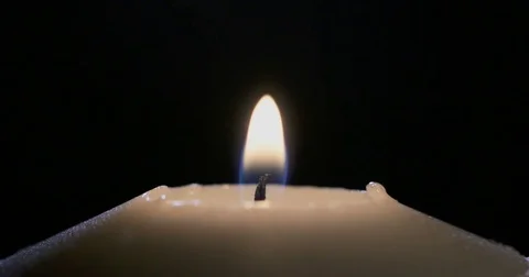 Macro shot of a white candle being put out Stock Footage 74349659