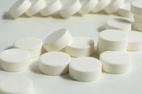 Macro shot of white effervescent tablets on white surface Stock Photos