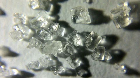 Macro shot of white sugar rotating Stock Footage 125800951