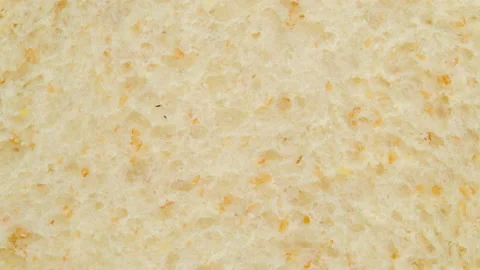 Macro shot of Whole wheat bread slice rotation, Close up. Stock Footage 146569340