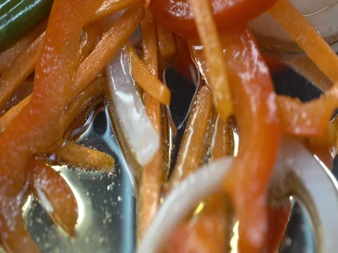 Macro shot Wok stir and fry vegetables with carrot, Bulgarian pepper, onion 1 Video stock 80364676