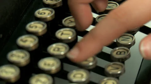 Macro shot  of woman's hands typing a text on an old typewriter. Rack focus Stock Footage 23689052