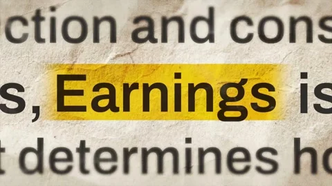 Macro Shot of the Word Earnings Highlighted on Vintage Paper Stock-Footage 335407794