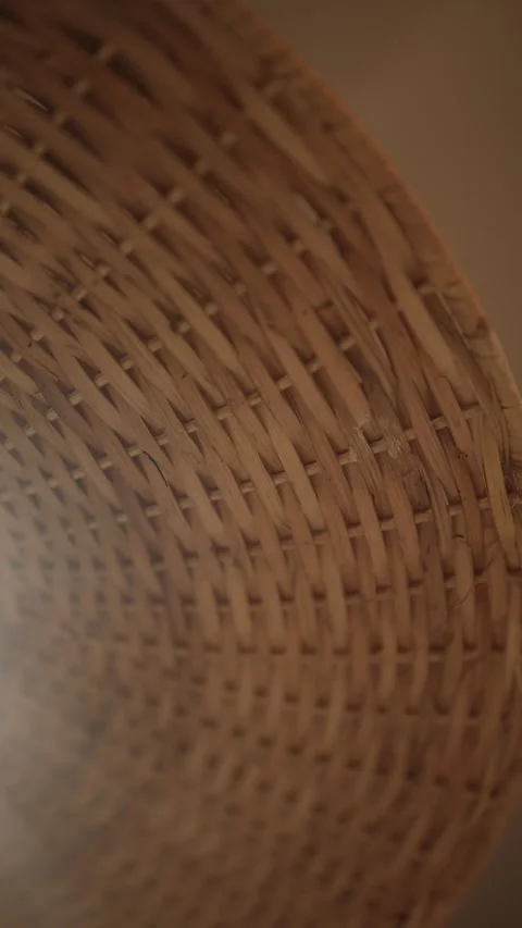 Macro Shot of Woven Wicker Lampshade Texture With Warm Light Seeping Through Stock Footage 346677874