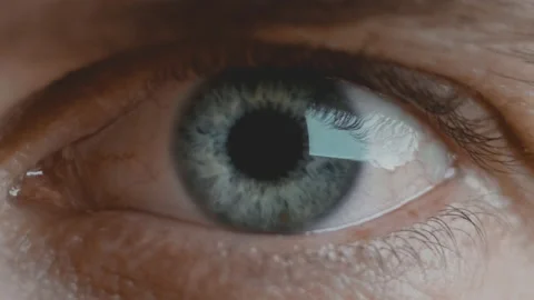Macro shot of young man's nictitating eye with blue iris and blood vessels Stock Footage 136474491