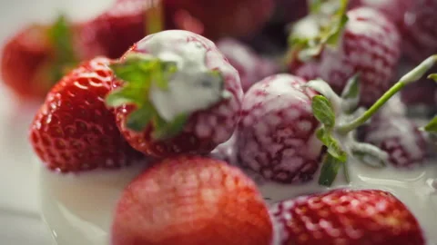 Macro shots with texture orientation of strawberries drizzled with sour crea Stock Footage 345528376