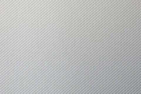 Macro of a silver cardboard texture with a squared pattern Stock Photos