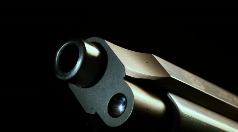 Macro silver pistol flyover Stock-Footage 753314