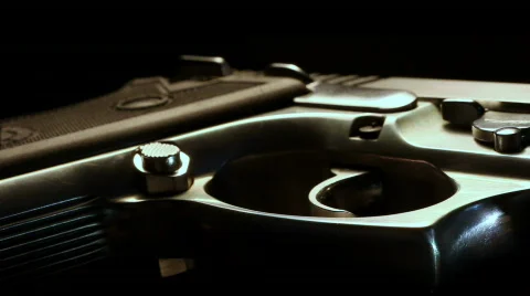 Macro silver pistol flyover Stock Footage 753476