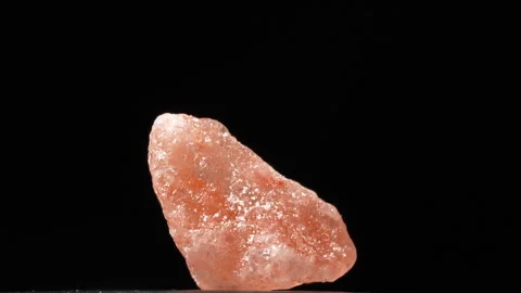 Macro Single Pink Himalayan Rock Salt Crystal On Black Stockbeeldmateriaal 331851442
